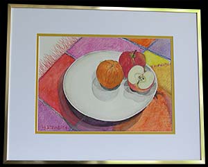 Clair’s Table is an original watercolor pencil artwork by Louise Steinbach. This still life depicts a white plate with a sliced apple and an orange on a colorful table linen.