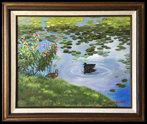 Mallards at Lake Katherine is an original oil painting by L.K. Steinbach. This landscape captures two ducks at the edge of a pond with lilypads and was painted in a traditional style.