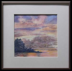 The Lake at Dusk is an original watercolor painting by Louise Steinbach. This landscape is the lavender and pink sky of a sunset over a reflective orange lake.