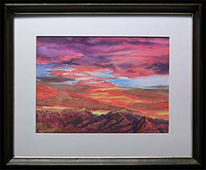 Santa Rita Sunset III is an original watercolor painting by Louise Steinbach. This cloudscape depicts an intense pink, orange, and blue sky over a mountain range at sunset.
